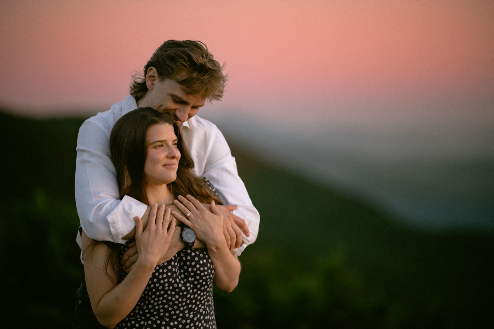 Lucia and Thor on the mountain at sunset